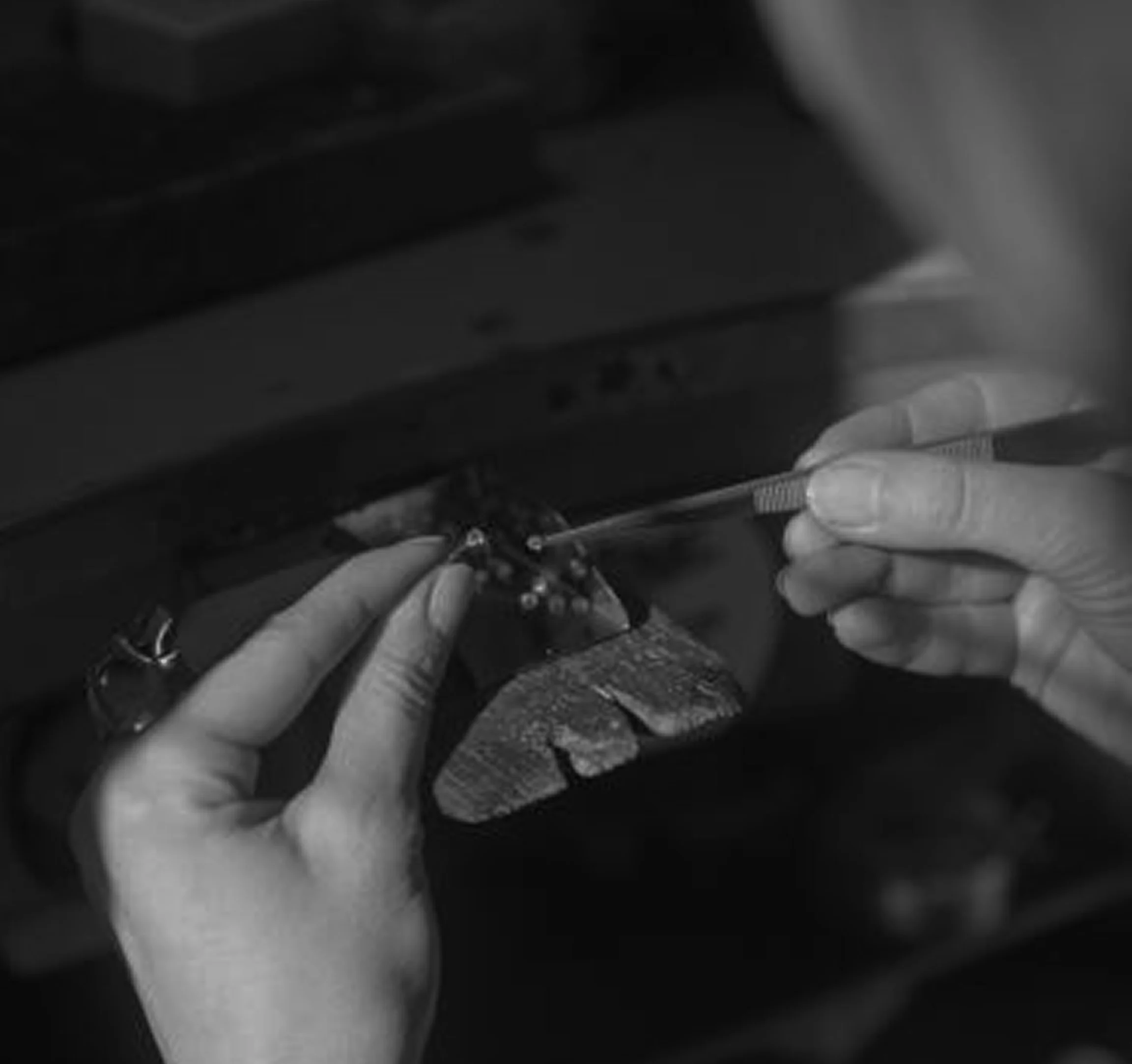 An Orfalis artisan finishing a piece by hand
